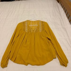 yellow long sleeved top